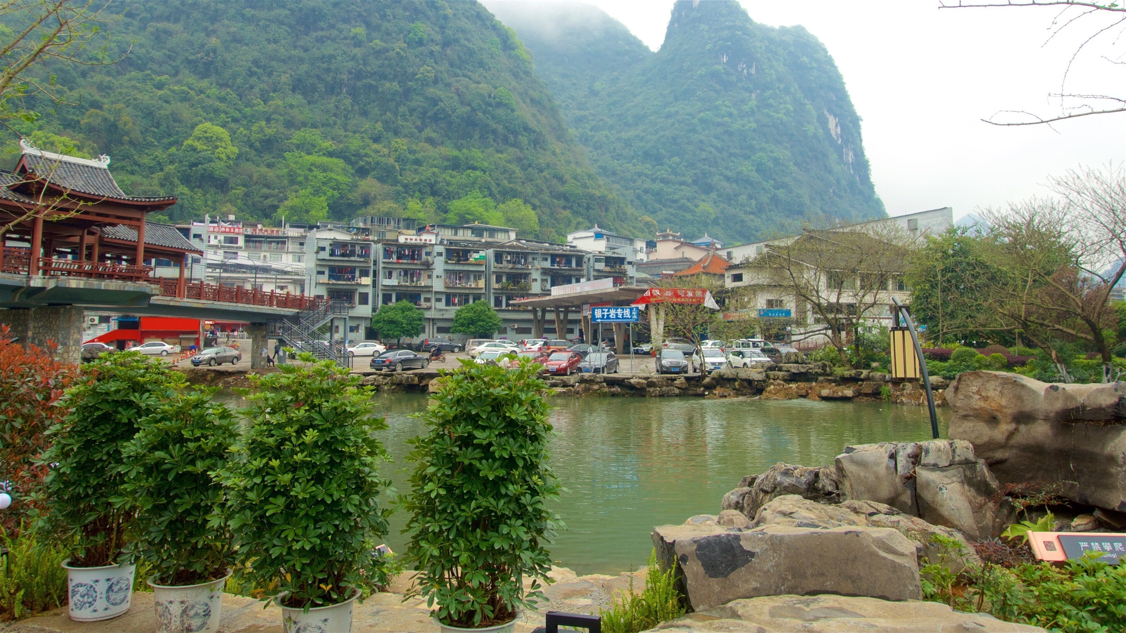 Yangshuo featuring mountains, mist or fog and a river or creek