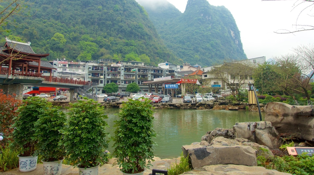 Yangshuo featuring mountains, mist or fog and a river or creek