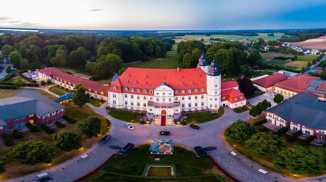 Germany, Mecklenburg-Western Pomerania, Mecklenburg Lake District, Goehren-Lebbin, Aerial view of Castle Hotel Fleesensee in the evening