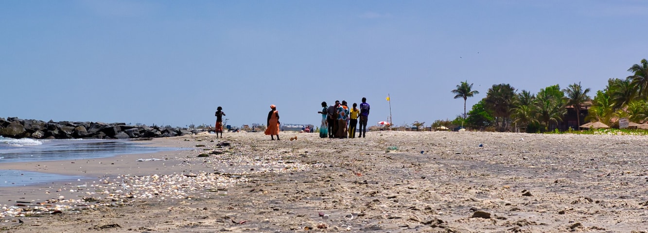 BAKAU, GAMBIA, AFRICA - CIRCA MARCH, 2017: Africans meet at the beach at noon