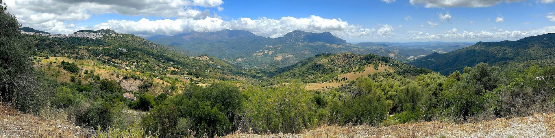 view over the hilly Andalusian landscape with the mountain village of Gaucin, Paraje Natural Los Reales de Sierra Bermeja, Estepona, Andalusia, Malaga, Spain