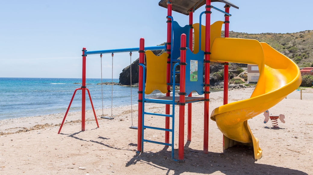 Children's playground with slide, swings and climbing area, located on the shore of the Spanish beach of Puntas de Calnegre.
