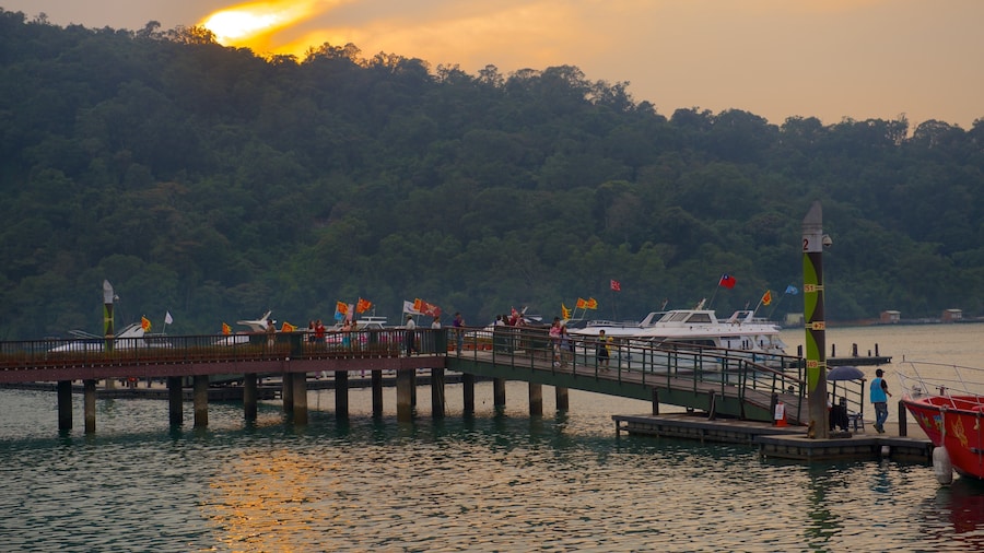 Sun Moon Lake featuring a bay or harbor, a sunset and a lake or waterhole