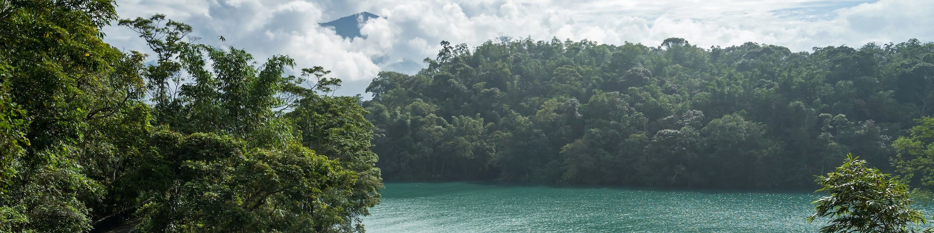 Young woman riding bicycle on Sun Moon lake bike trail
