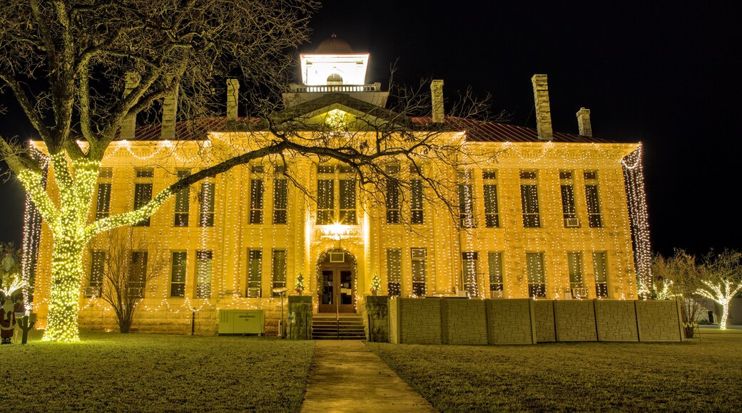 The Blanco County Court House is all decked out for the Christmas holiday season with strings of lights hanging from top to bottom on all for sides of the building. Johnson City, Texas.