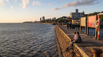 Tamsui showing a sunset, a coastal town and general coastal views