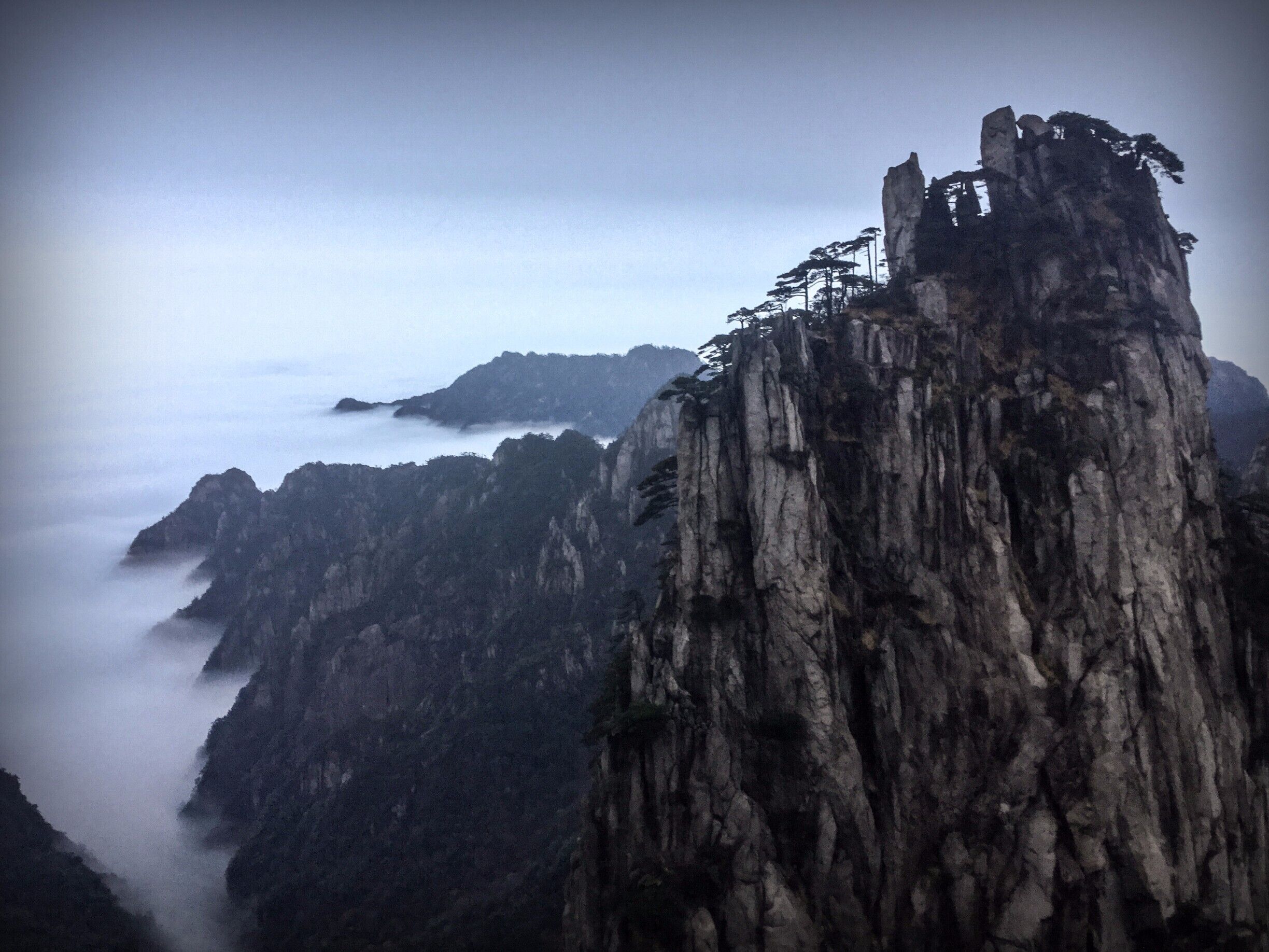 My pen is alight and my body aflame. Until both burn down to ash, my love and my hate will remain here in the world.

Ba Jin

I awoke early in the morning to try and catch the sunrise, but it was hidden behind a massive curtain of clouds.  Nonetheless, the beauty and the stillness of that morning was perfect.  Not perfect to take a photograph, at least for someone of my ability, but perfect enough to fill my soul for another day.  There are many special places on this planet, and this is one of them.

#hiking #China