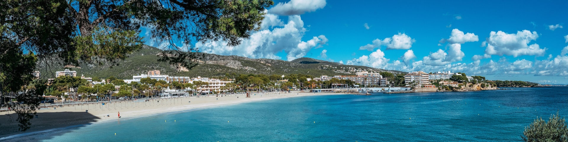 Beautiful sunny view of popular beach in Majorca, with the clean and blue water, in Balearic Islands, Spain