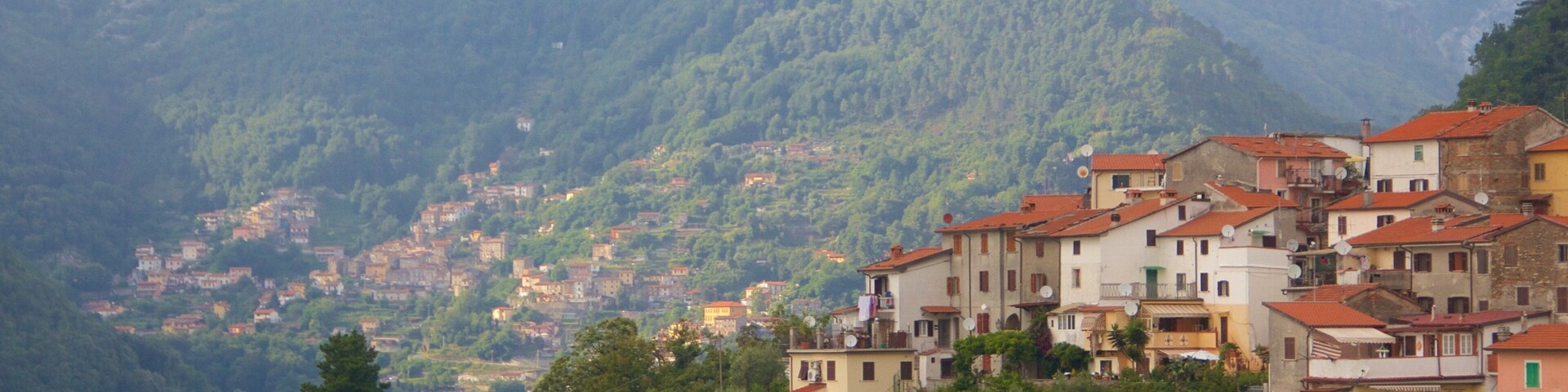 Massa Carrara featuring mountains and a small town or village