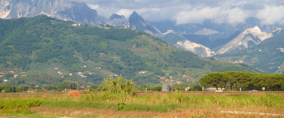 Massa Carrara featuring mist or fog, mountains and tranquil scenes