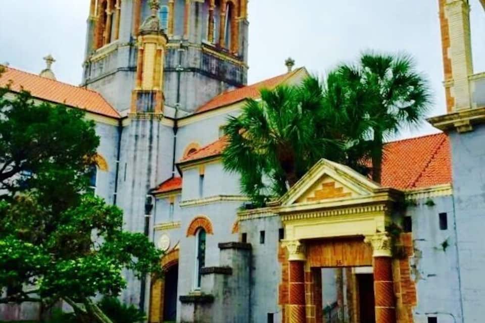 A historic church with a prominent dome and bell tower.