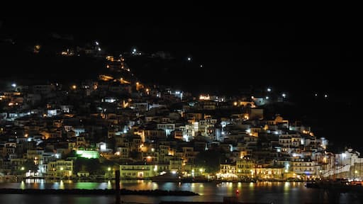 Skopelos Town by night. Skopelos is a wonderful Greek island with an authentic feel and most certainly my favourite. Reputed to be the greenest of all the Greek islands it is covered in pine forests.
It is also relatively unspoilt as it does not have an airport & is not the easiest island to get to. Like nearly all the islands however it can get busy at the height of the summer.
The main town tumbles down to the harbour through a mass of narrow streets where rubbish is still collected by mule. The tavernas abound with live music & several well known Greek musicians live and/or perform regularly here.