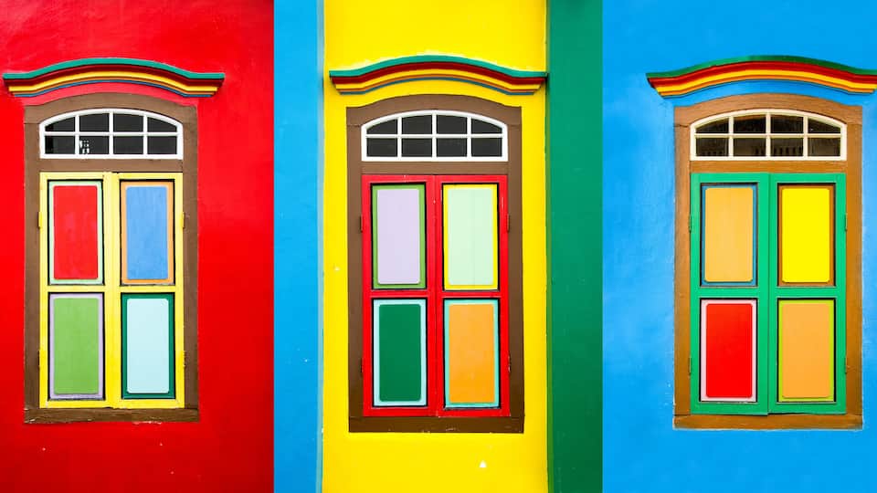 Collage of 3 colorful windows on the facade of a house in Little India, Singapore
