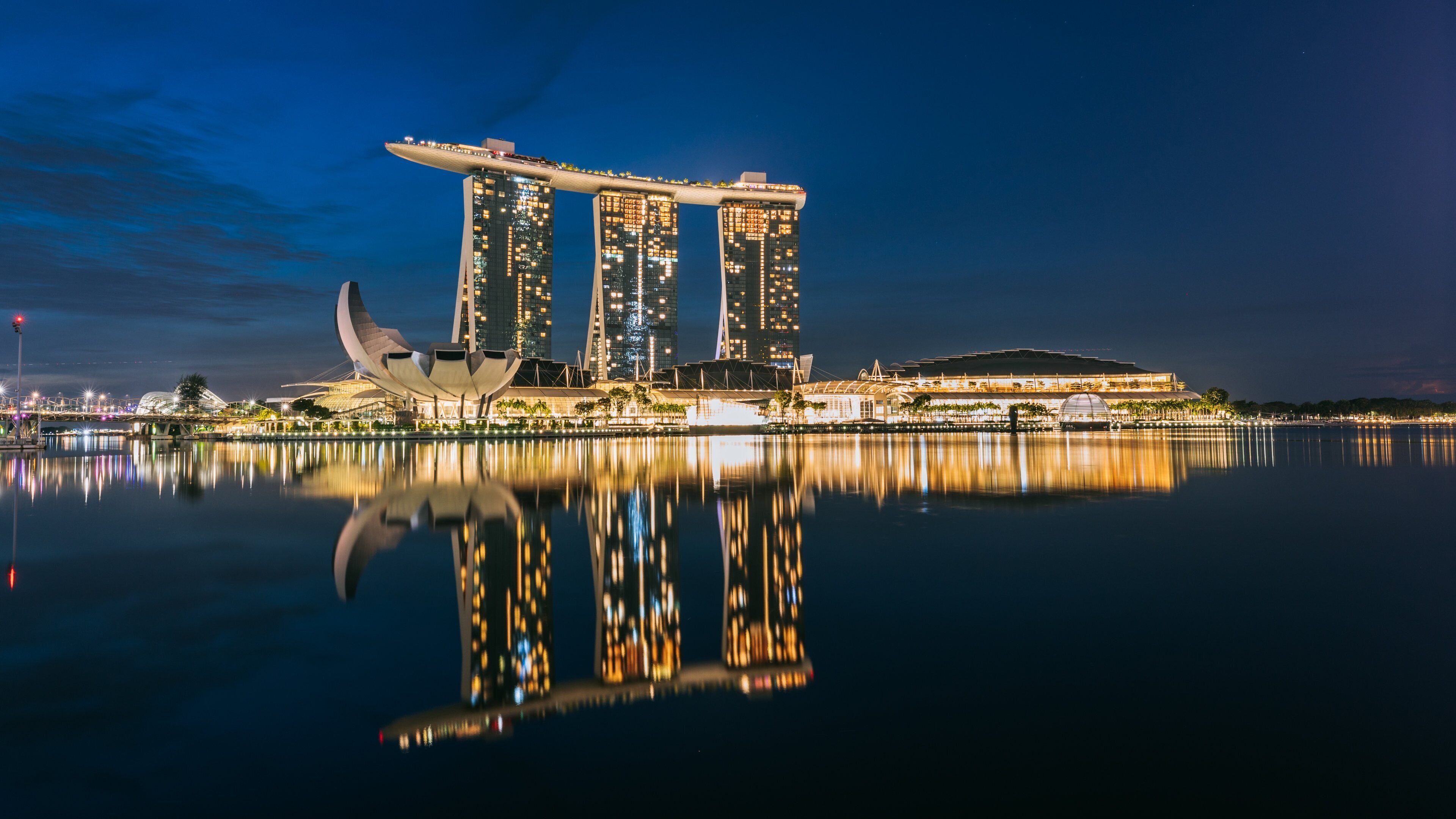 Marina Bay featuring a high rise building, night scenes and a bay or harbor