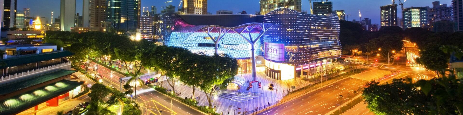Singapore showing night scenes, a high-rise building and city views