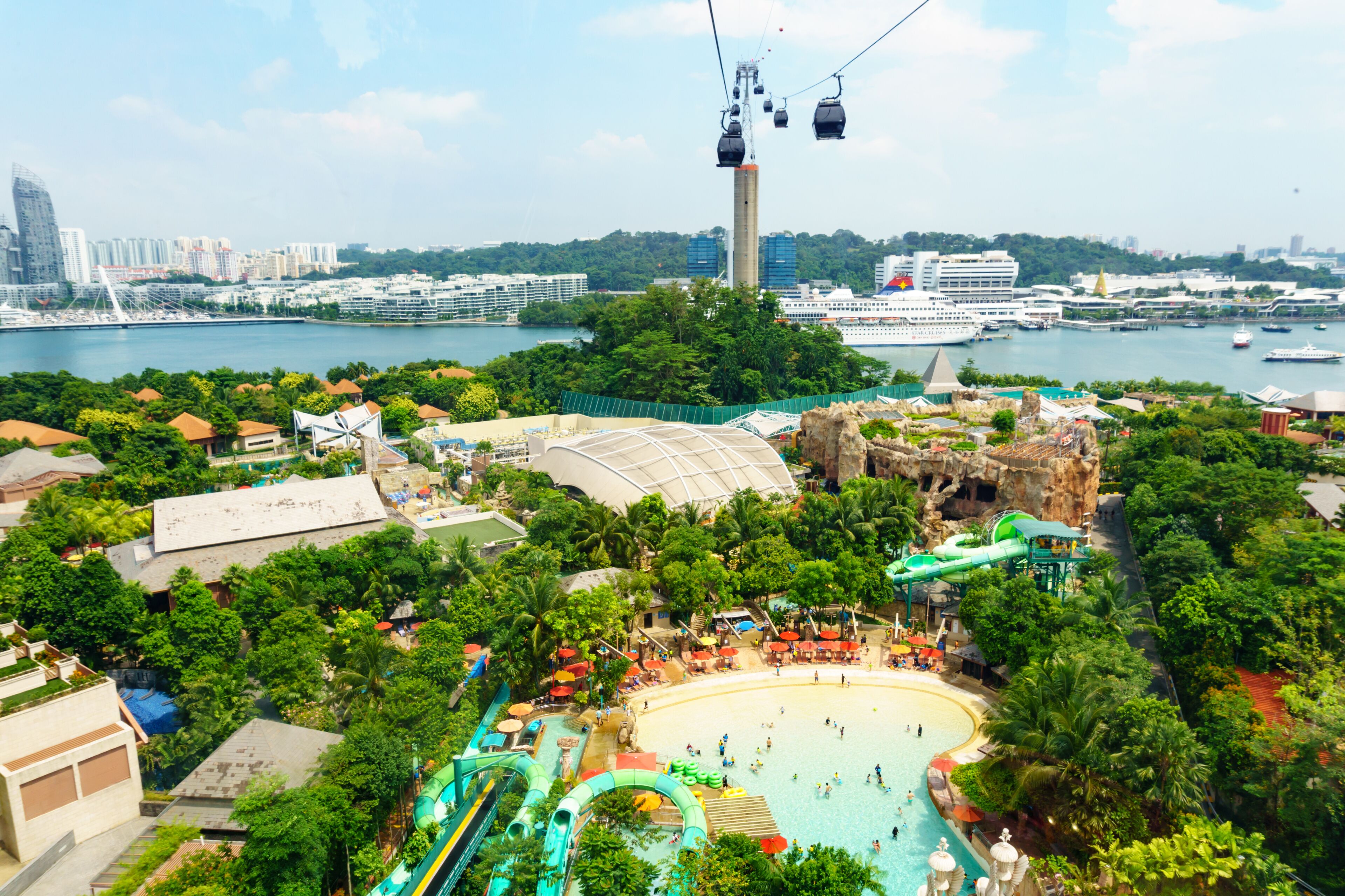 A water park with a large pool, a wave pool, and a cable car system.