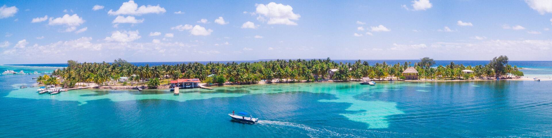 Aerial Drone view of South Water Caye tropical island in Belize barrier reef. A typical Caribbean island with turquoise water