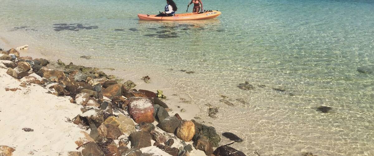I took this picture of my friends having a blast while kayaking. On the island we got to eat, drink, snorkel, play volleyball, kayak, and do many more fun activities!