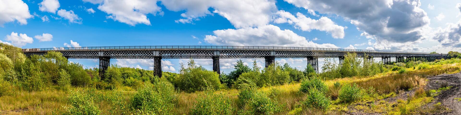 A panorama view of the Bennerley Viaduct over the Erewash canal in summertime