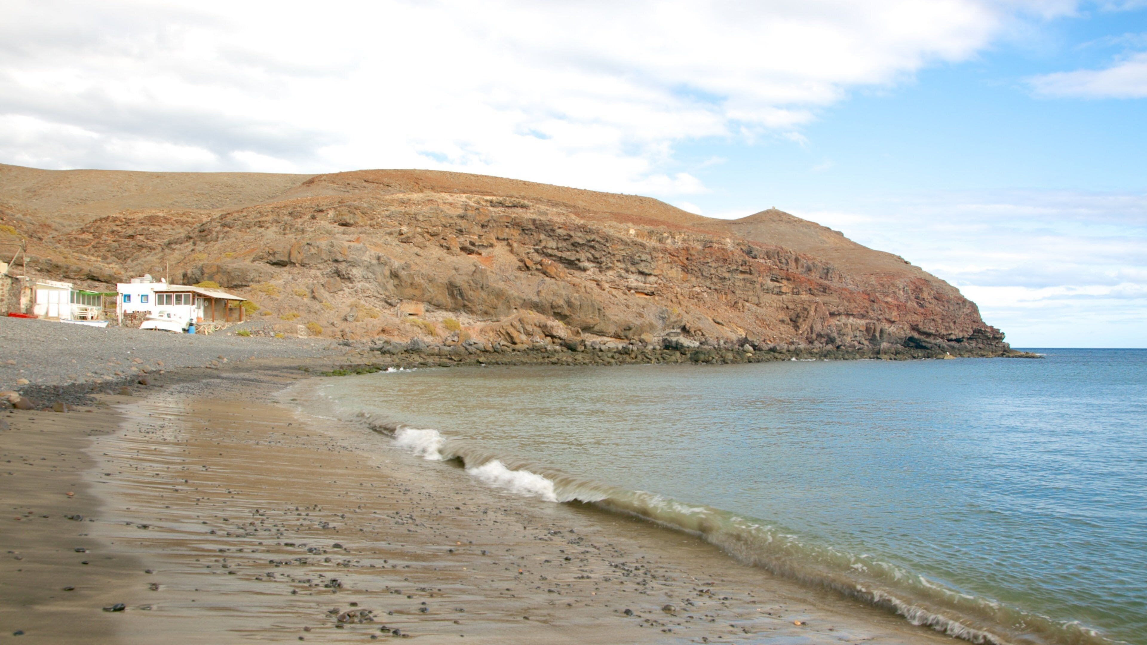 Playa Barca which includes rocky coastline