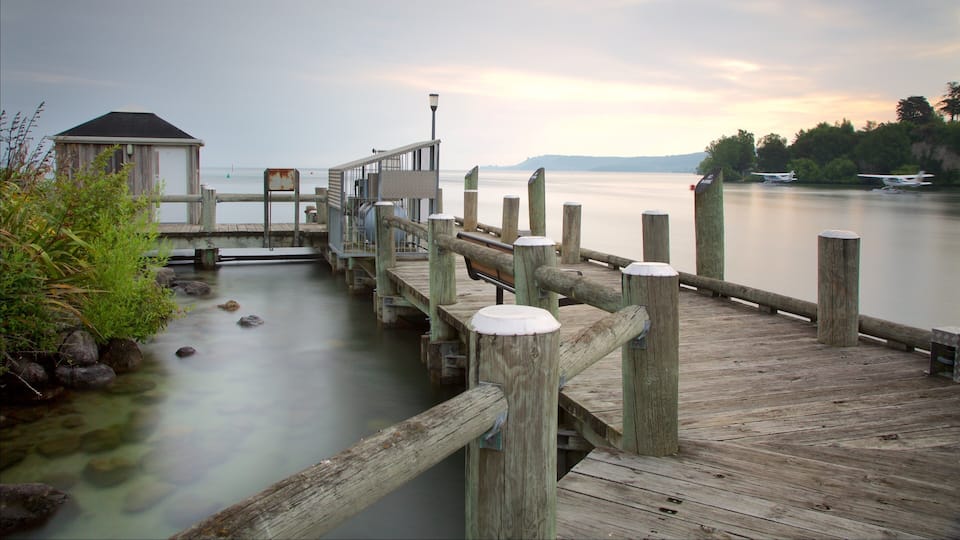 Lake Taupo which includes a sunset, aircraft and a lake or waterhole