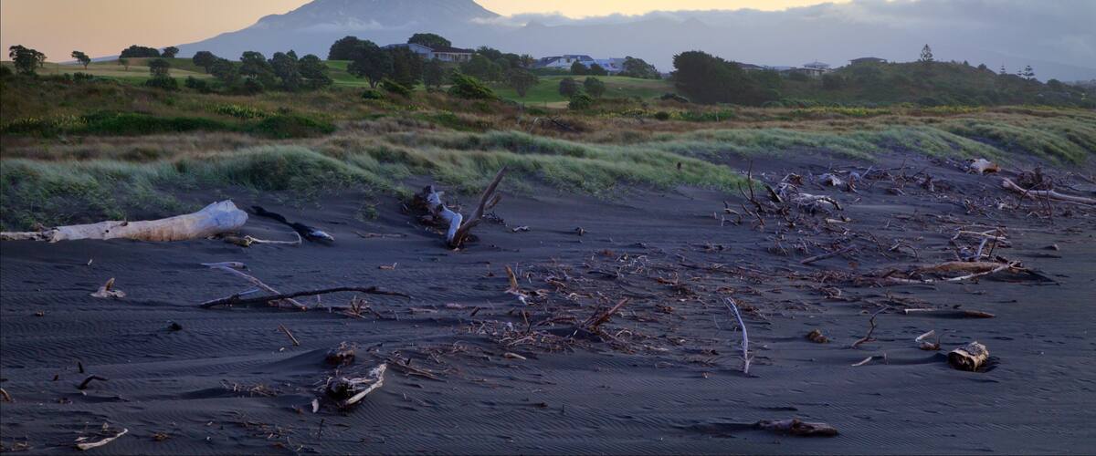 Taranaki which includes a sunset, tranquil scenes and mountains