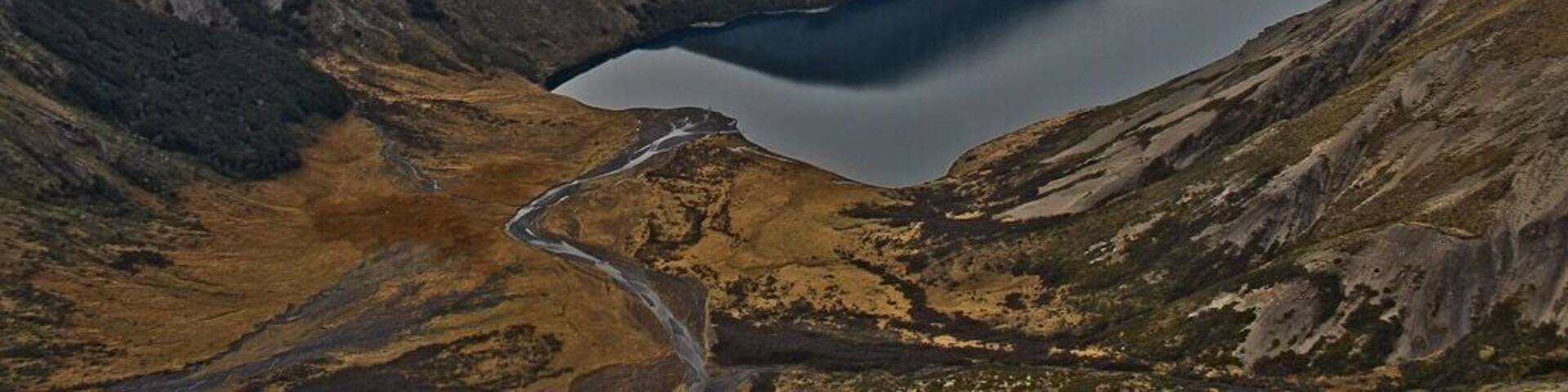 Lake Tennyson is a beautiful, off the beaten track destination in Canterbury, New Zealand. You can camp at the southern end of the lake and drive in from St Arnaud in Nelson Lakes National Park (to the north) or from Hanmer Springs to the south. If you have lots of cash, you can hire a helicopter (I was on a work trip when I got to go on one around the area)!