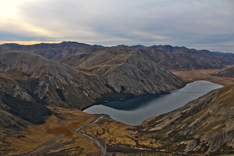 Lake Tennyson is a beautiful, off the beaten track destination in Canterbury, New Zealand. You can camp at the southern end of the lake and drive in from St Arnaud in Nelson Lakes National Park (to the north) or from Hanmer Springs to the south. If you have lots of cash, you can hire a helicopter (I was on a work trip when I got to go on one around the area)!
