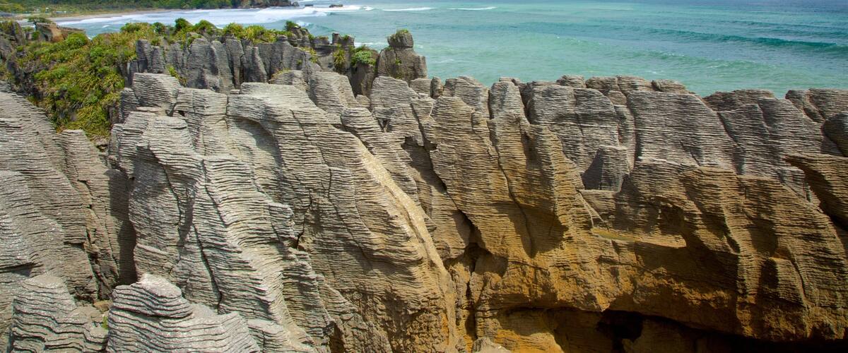 West Coast New Zealand which includes rugged coastline, landscape views and mountains