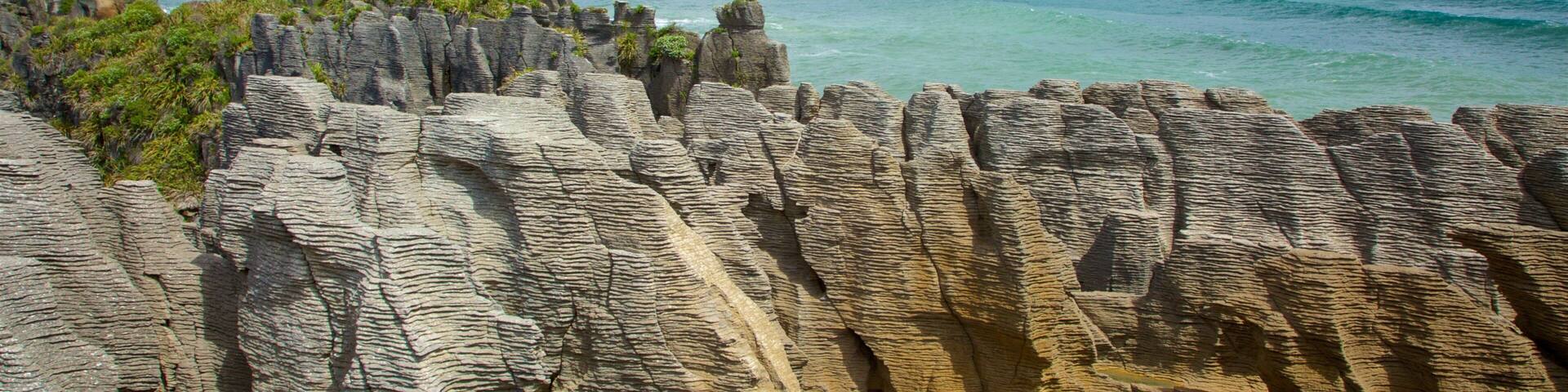 West Coast New Zealand which includes rugged coastline, landscape views and mountains