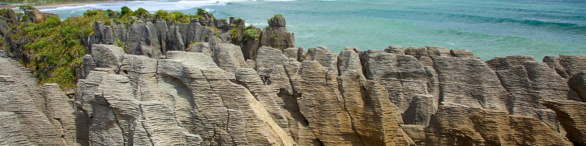West Coast New Zealand which includes rugged coastline, landscape views and mountains