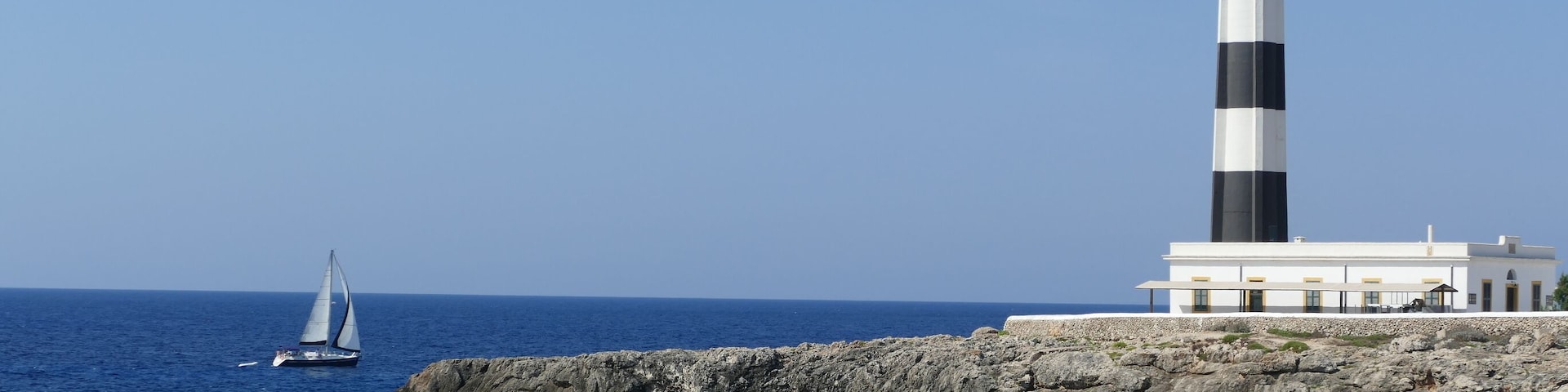 The lighthouse at the SW corner of Menorca has an expensive restaurant ideal for the Menorcan sunsets but we preferred taking shots of the very photogenic location