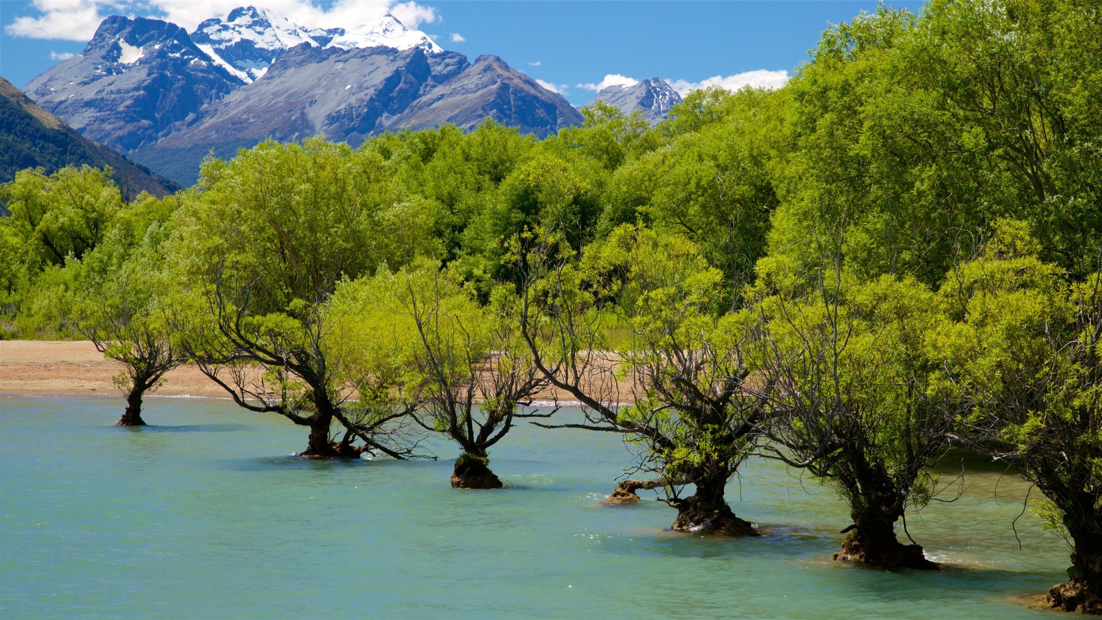 Glenorchy showing a pebble beach, mountains and a lake or waterhole