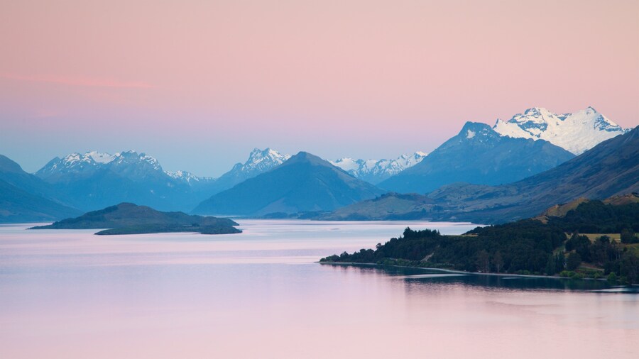 Lake Wakatipu featuring mountains, a lake or waterhole and a sunset