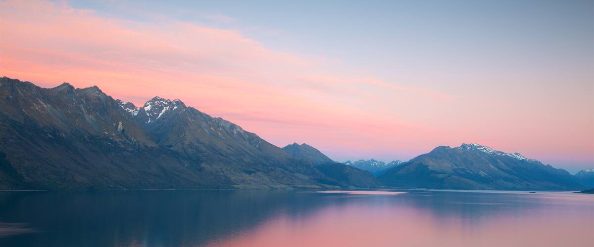 Lake Wakatipu showing mountains, a sunset and a lake or waterhole