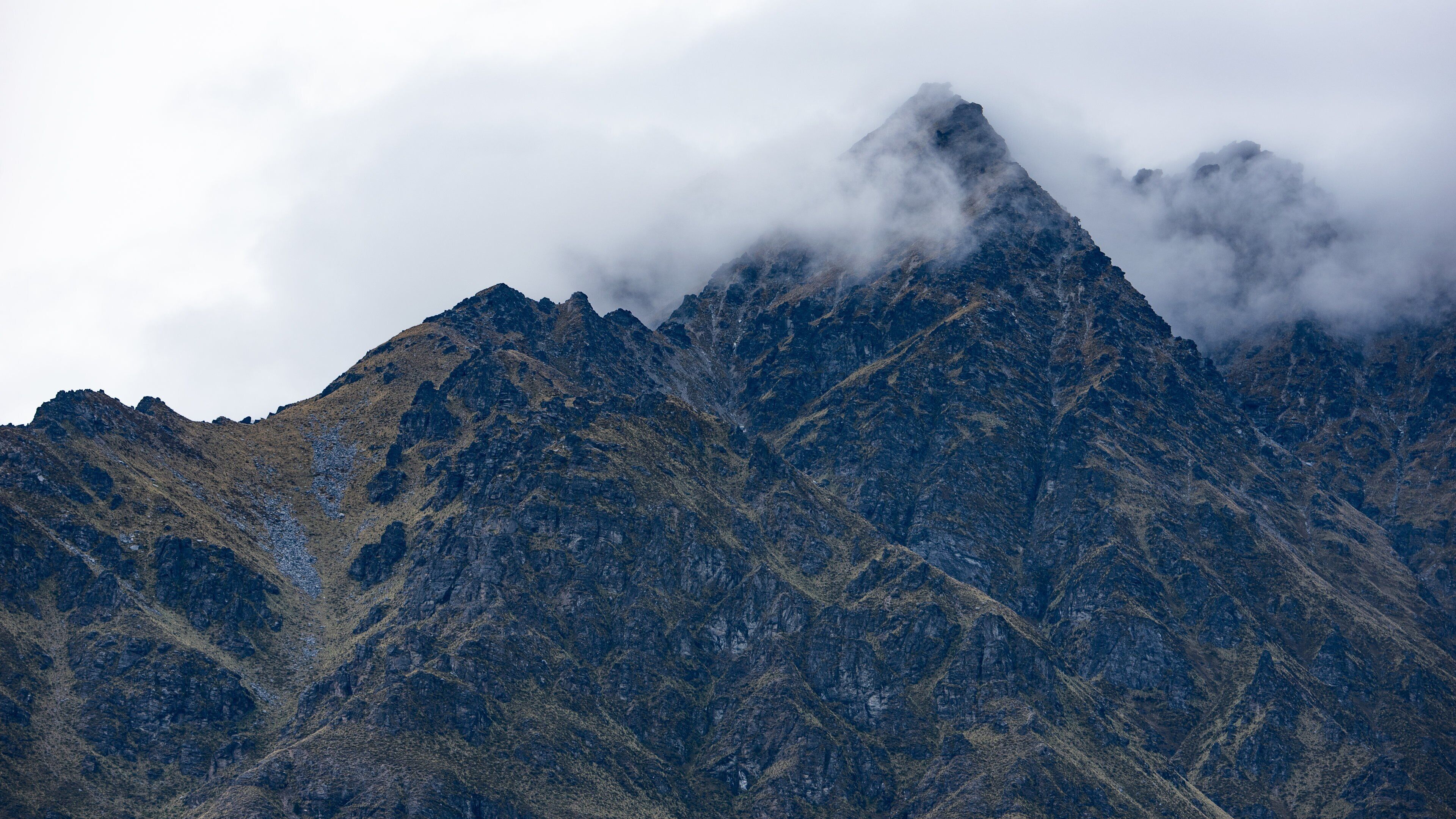 Lake Wakatipu which includes mountains and mist or fog