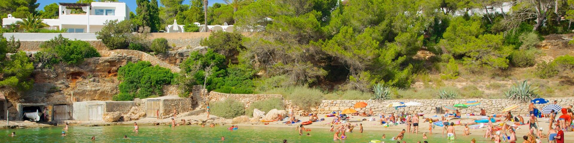 Cala Gracio showing jet skiing, a coastal town and a sandy beach