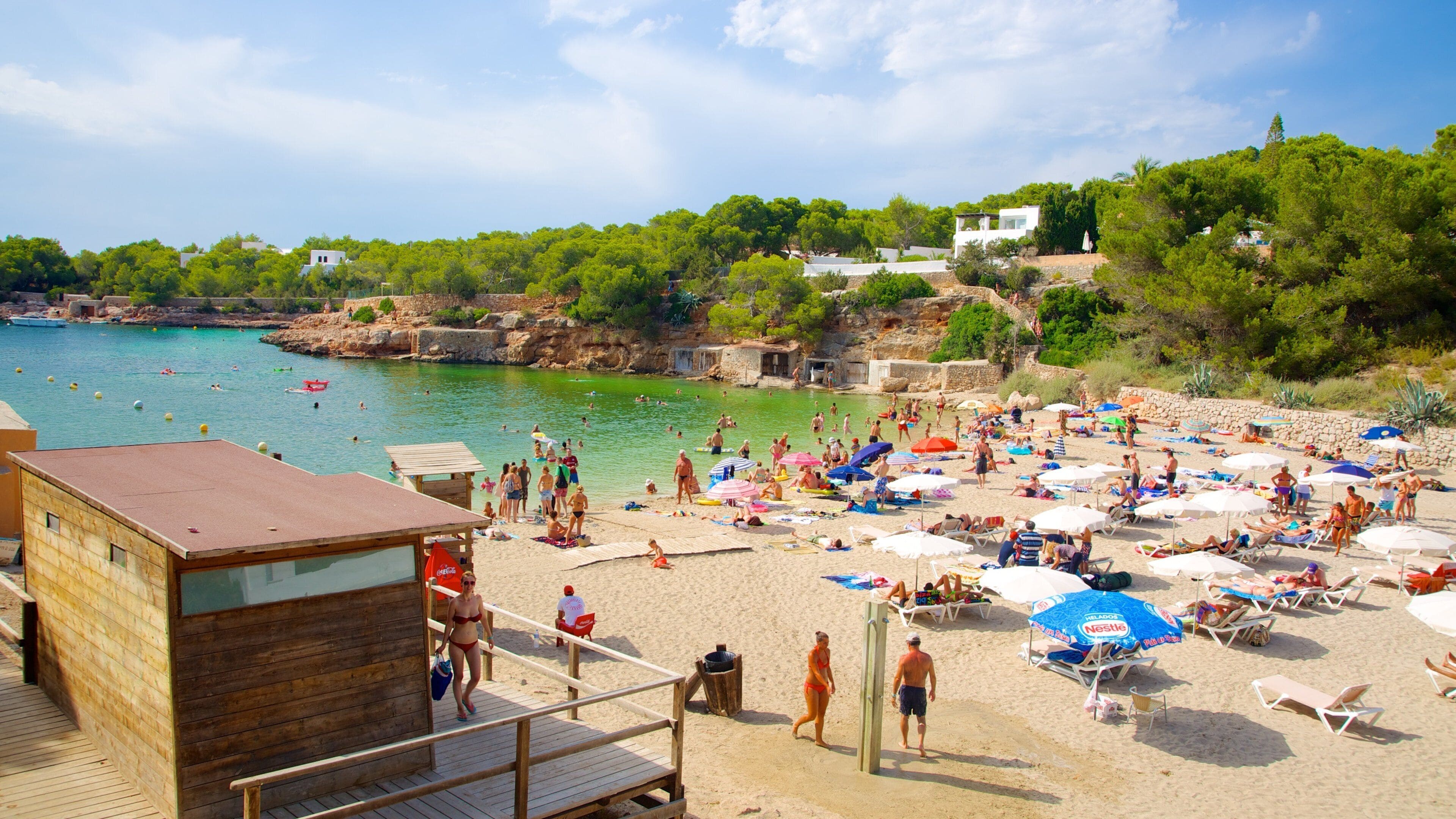 Cala Gracio featuring a coastal town, a beach and swimming
