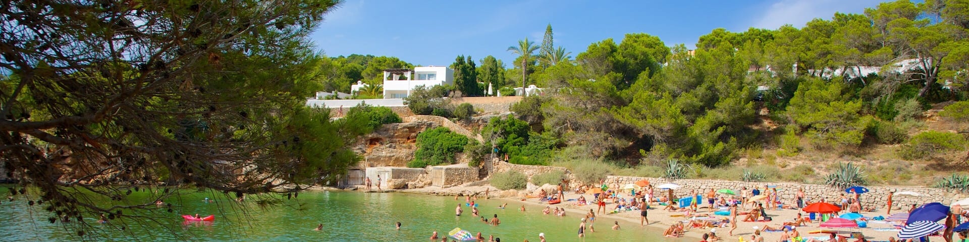 Cala Gracio which includes a sandy beach, swimming and a coastal town