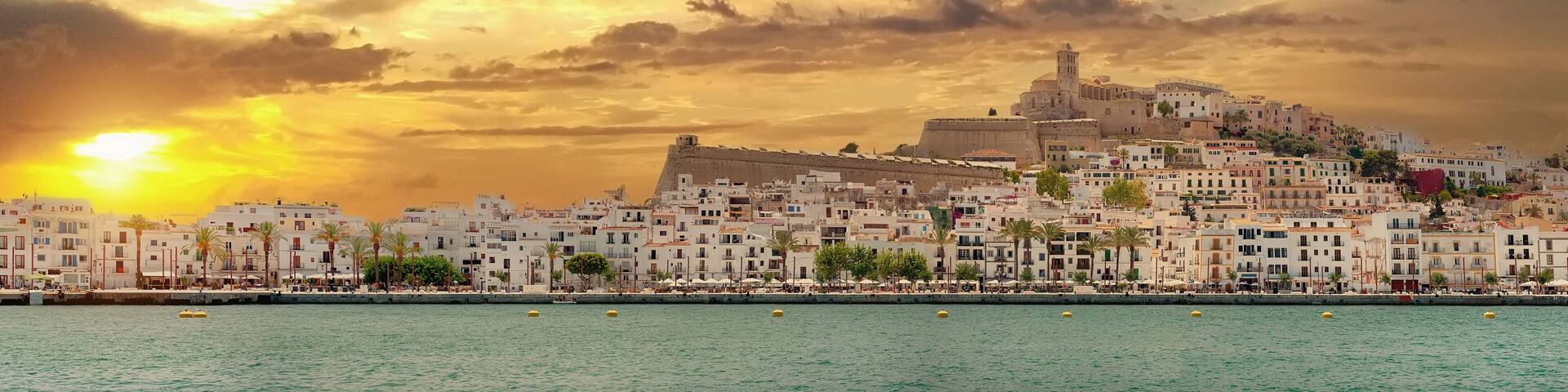 Panoramic view of the Dalt Vila of Ibiza on cloudy sunset sky background. The fortification of the city were listed as a UNESCO Heritage Site in 1999. Balearic Islands, Espana, Spain