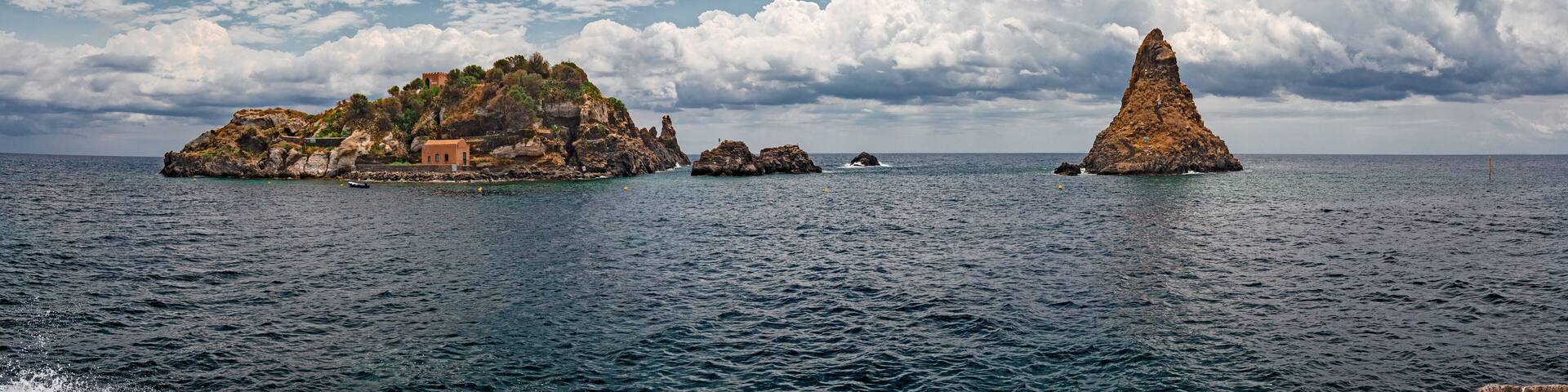 Panoramic view of the island Lachea and the Ciclopi islands in Aci Trezza in Sicily, Italy.