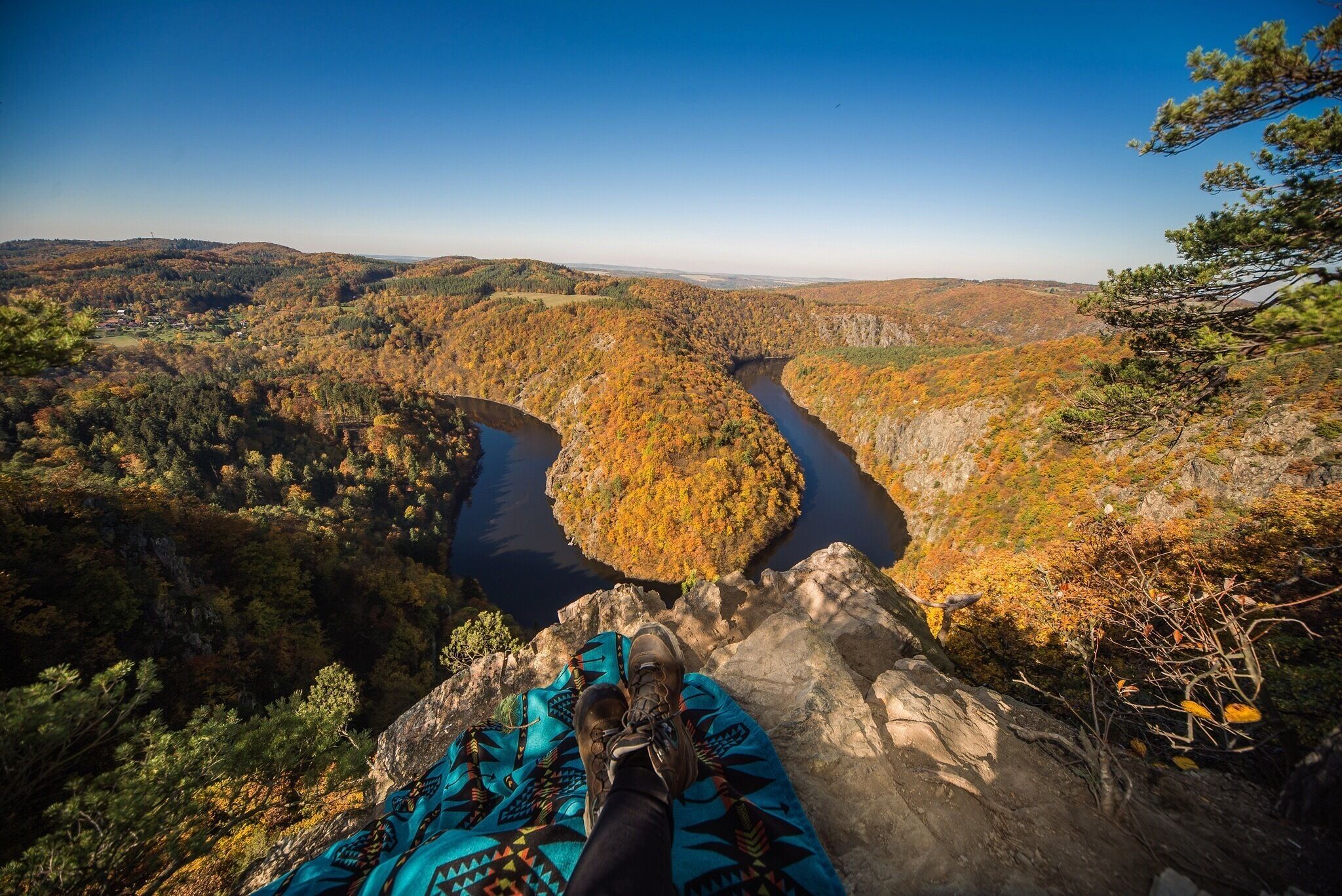 A narrow canyon of Vltava where the river battled through a deep rocky valley and formed rapids called "Svatojánské proudy" (Midsummer or St. John's currents) has witnessed tramping and woodcraft movement since its very beginning. Still, whole generations gather here and enjoy the unique spirit of the place.

#autumn #fallroadtrip #czechrepublic #europe #river #amazingview #hiking