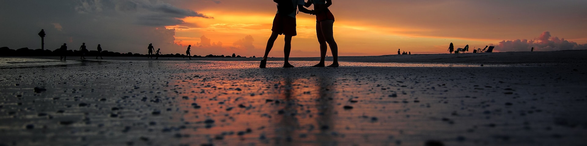 Silhouettes of a couple kissing on a beach at Honeymoon Island State Park near Clearwater, Florida