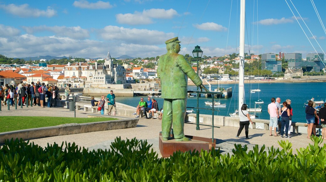 Cascais fasiliteter samt statue eller skulptur, kyst og kystby