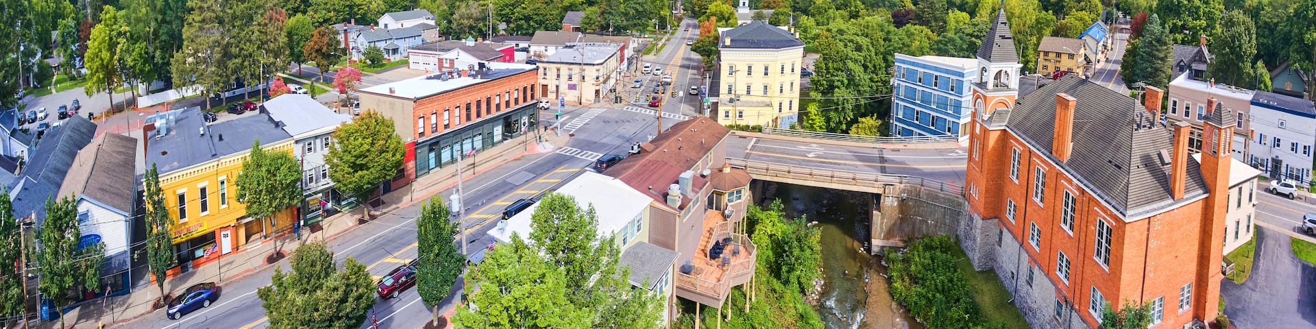 Aerial panoramic view over small town in New York Honeoye Falls