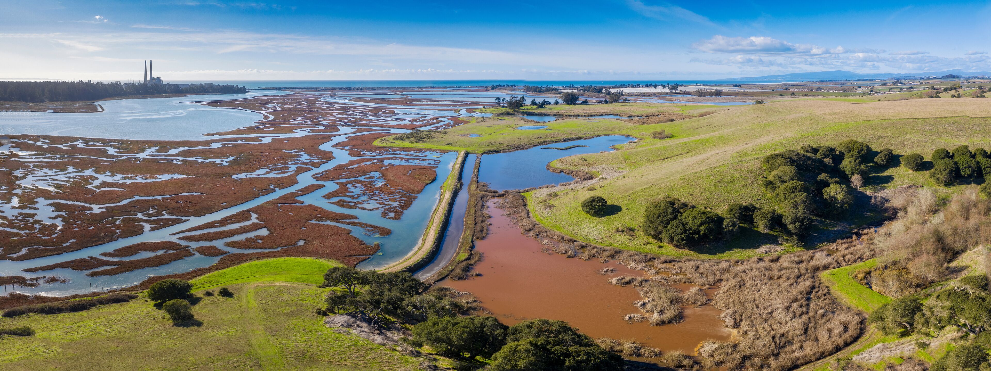 Aerial Panoramic View of Elkhorn Slough, Moss Landing, California. Elkhorn Slough is a 7-mile-long tidal slough and estuary on Monterey Bay in Monterey County, California. 
