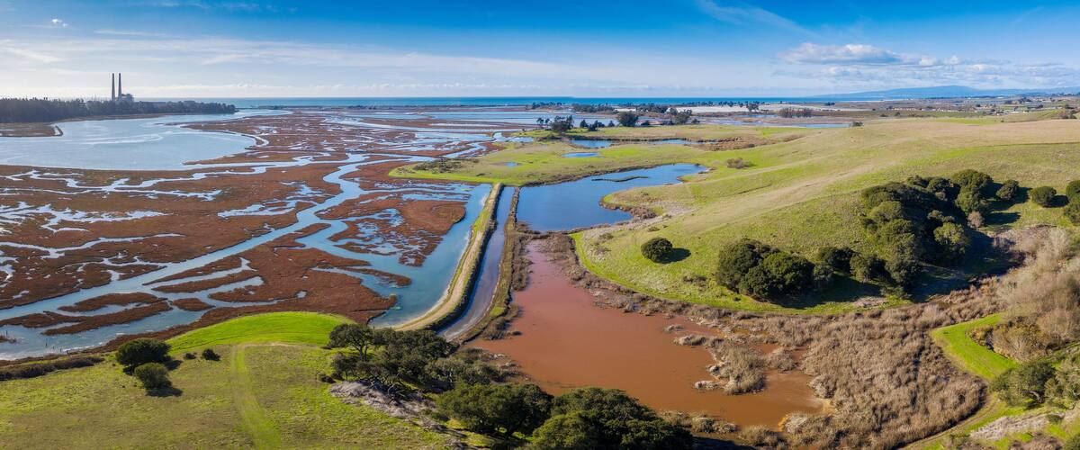 Aerial Panoramic View of Elkhorn Slough, Moss Landing, California. Elkhorn Slough is a 7-mile-long tidal slough and estuary on Monterey Bay in Monterey County, California.
