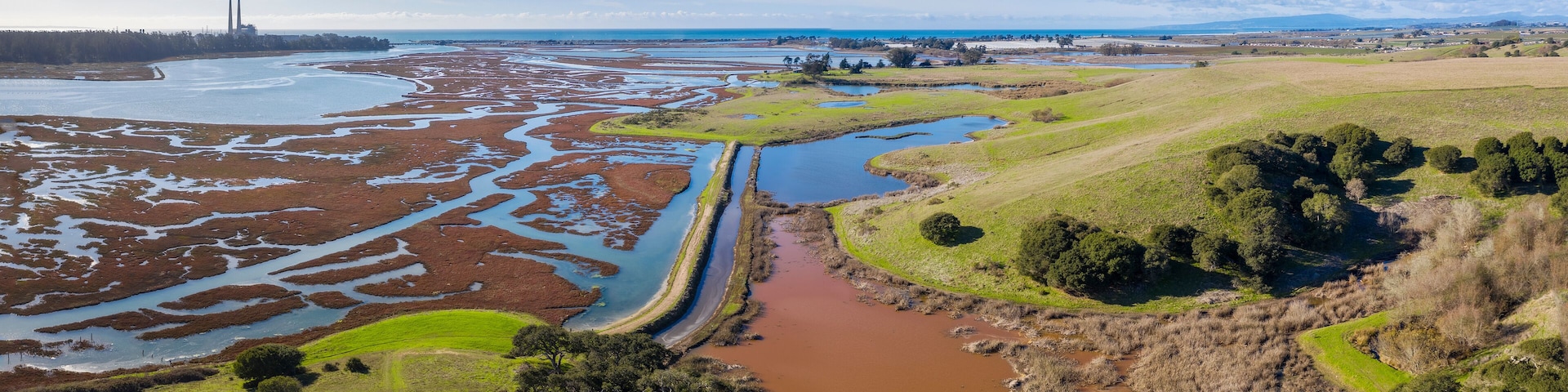 Aerial Panoramic View of Elkhorn Slough, Moss Landing, California. Elkhorn Slough is a 7-mile-long tidal slough and estuary on Monterey Bay in Monterey County, California.