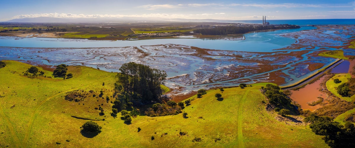 Aerial Panoramic View of Elkhorn Slough, Moss Landing, California. Elkhorn Slough is a 7-mile-long tidal slough and estuary on Monterey Bay in Monterey County, California.