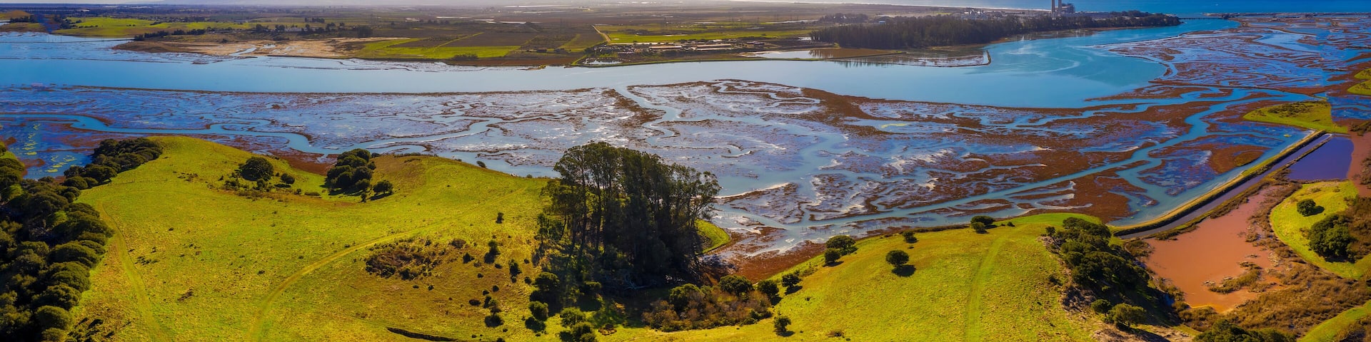 Aerial Panoramic View of Elkhorn Slough, Moss Landing, California. Elkhorn Slough is a 7-mile-long tidal slough and estuary on Monterey Bay in Monterey County, California.